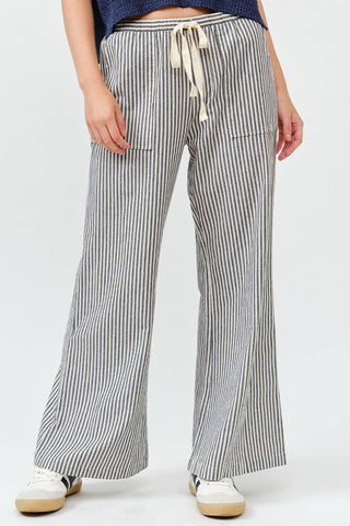 Striped wide leg drawstring pants with elastic waistband and pockets in neutral tones