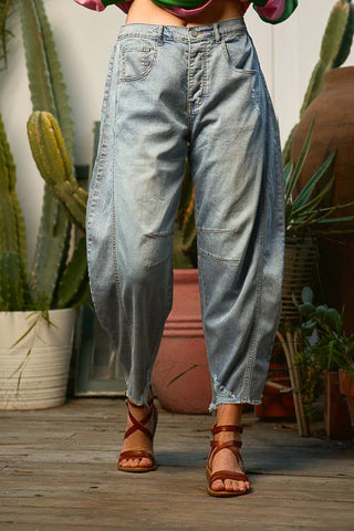 Light wash barrel leg jeans with relaxed fit and tapered ankle detail