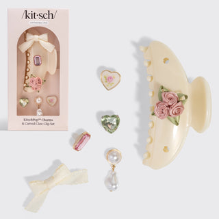 Pearlized cream curved claw clip with vintage-inspired charm accents and soft feminine design.