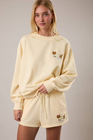 Cozy boutique sweatshirt styled with matching shorts