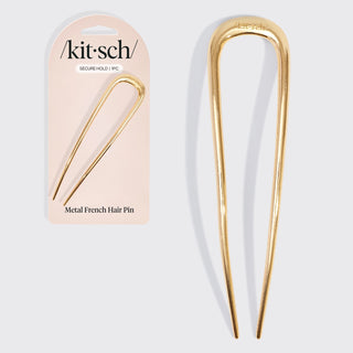 Gold metal French hair pin used for elegant buns and minimalist hairstyles.