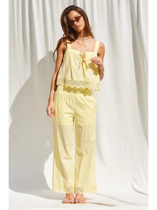 Soft yellow wide leg pants with lace trim hem and elastic waistband